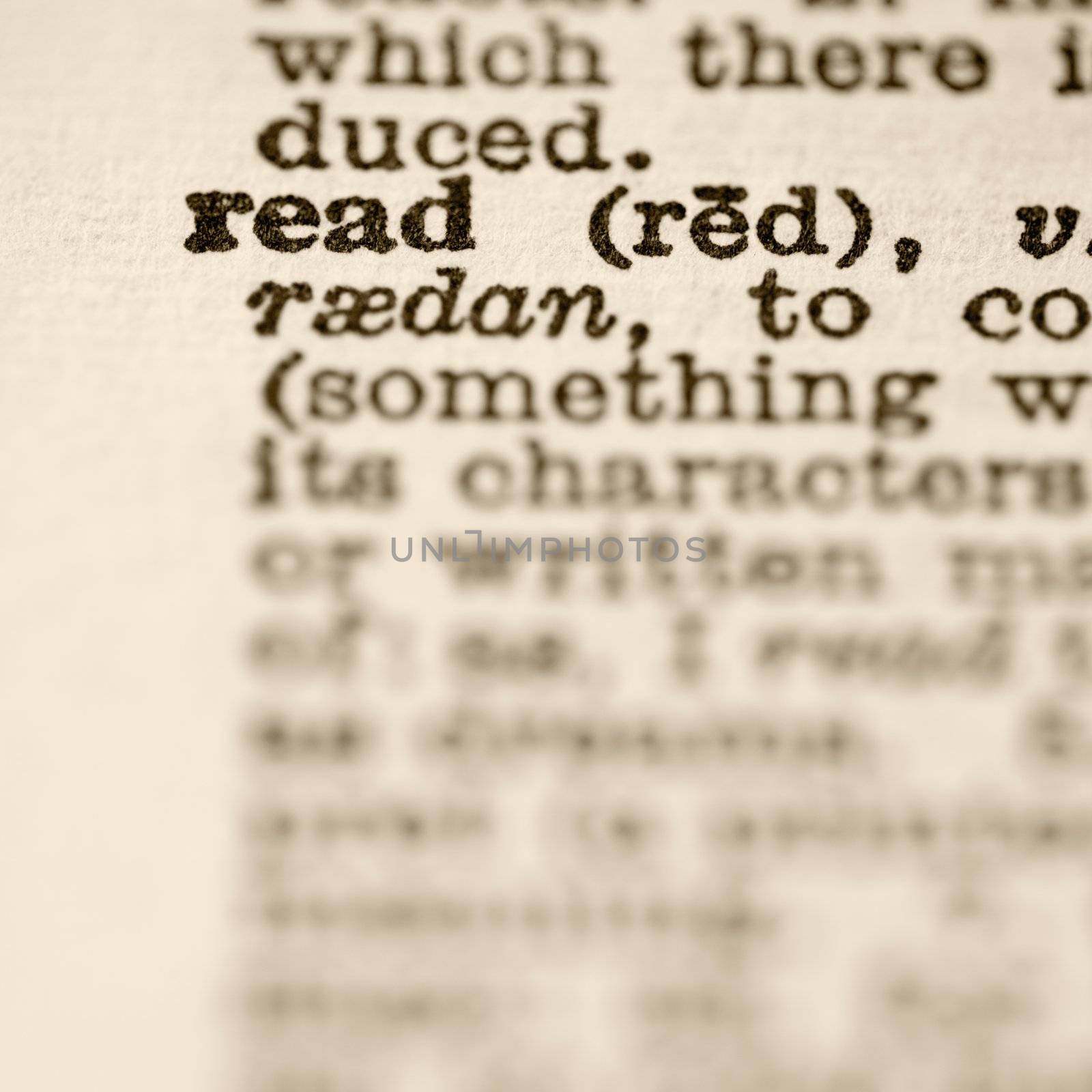 Selective focus of dictionary definition for the word read.
