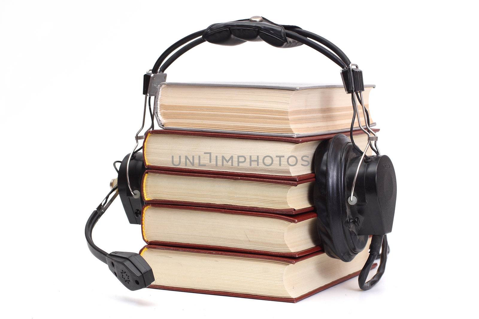 audiobook conception with headphones and books
