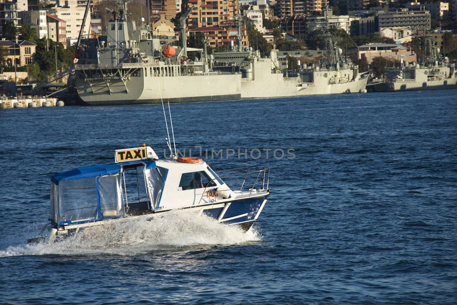 Water taxi and view of buildings and boats in Sydney, Australia.