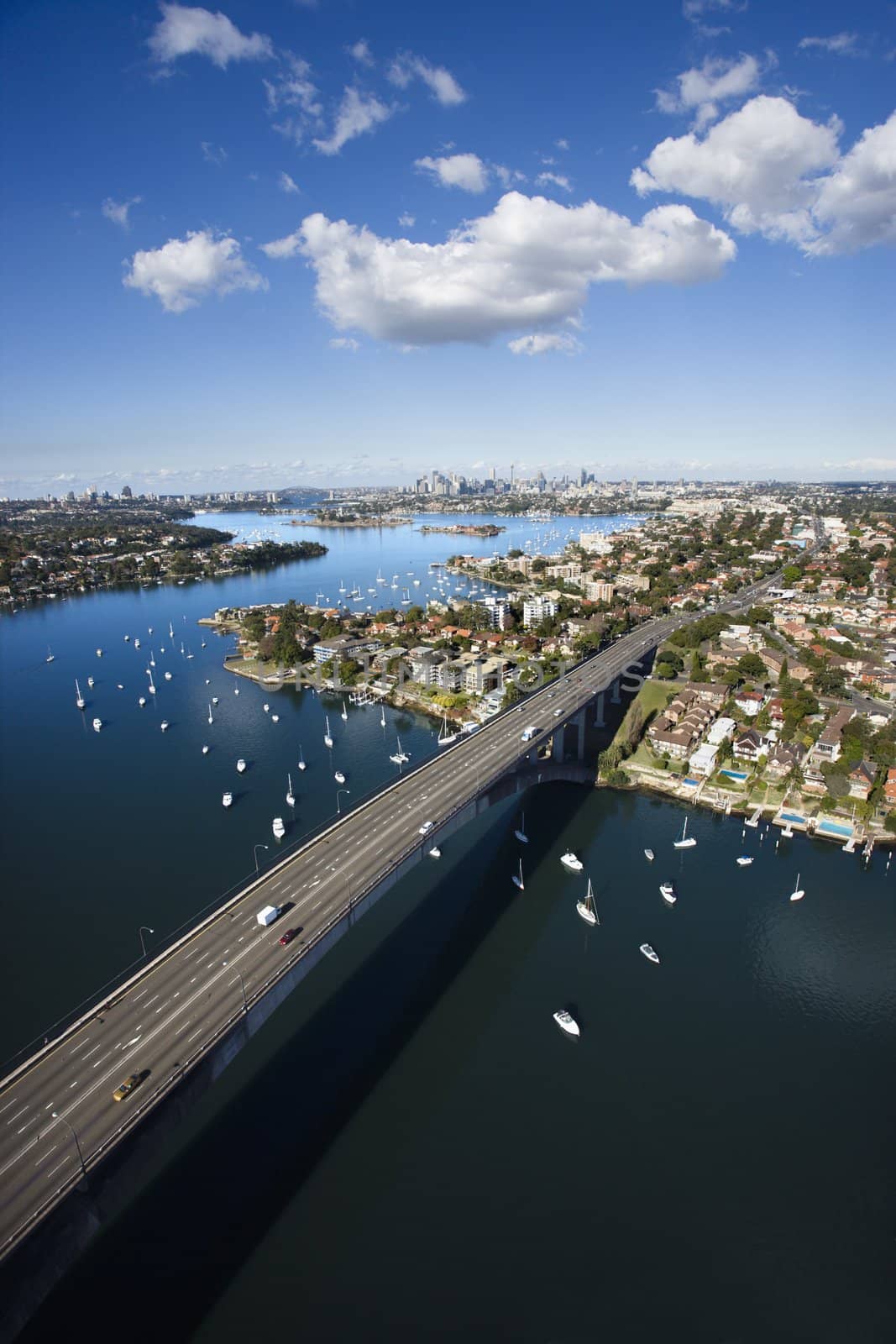 Aerial view of Victoria Road bridge and boats in Sydney, Australia.