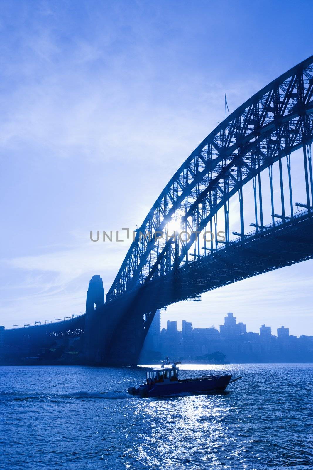 Boat under bridge. by iofoto