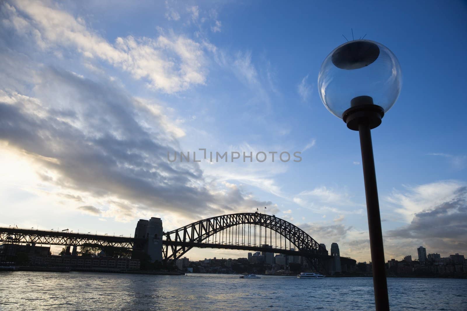 Sydney Harbour, Australia, with view of Sydney Harbour bridge and lamppost.