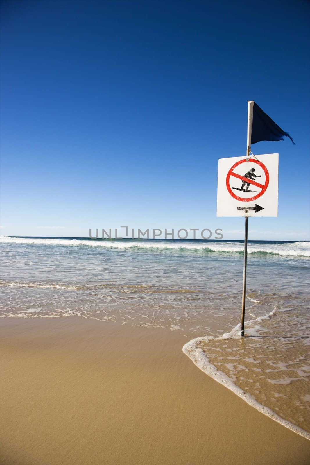 No surfing sign on beach in Surfers Paradise, Australia.