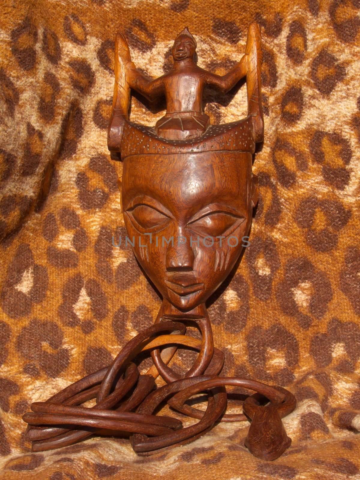 Digital image of an African still life with fecundity wooden mask
