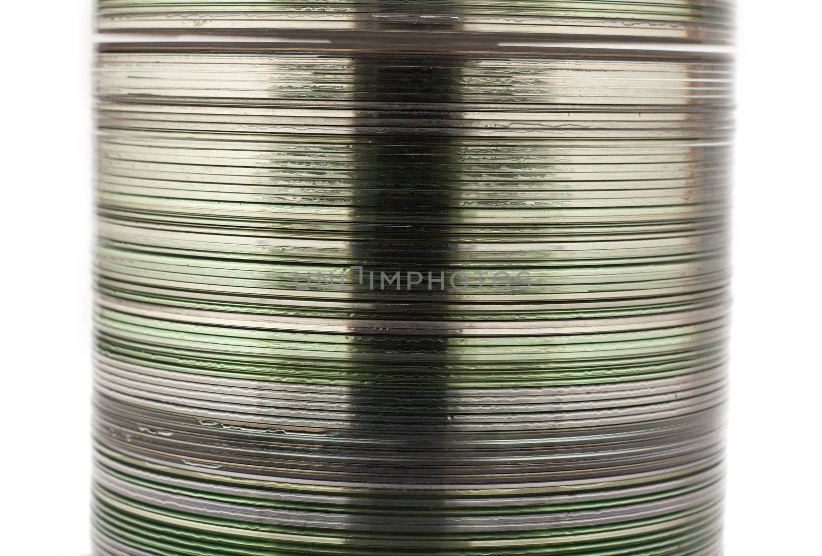 Pile CD disk on spindel insulated on white background