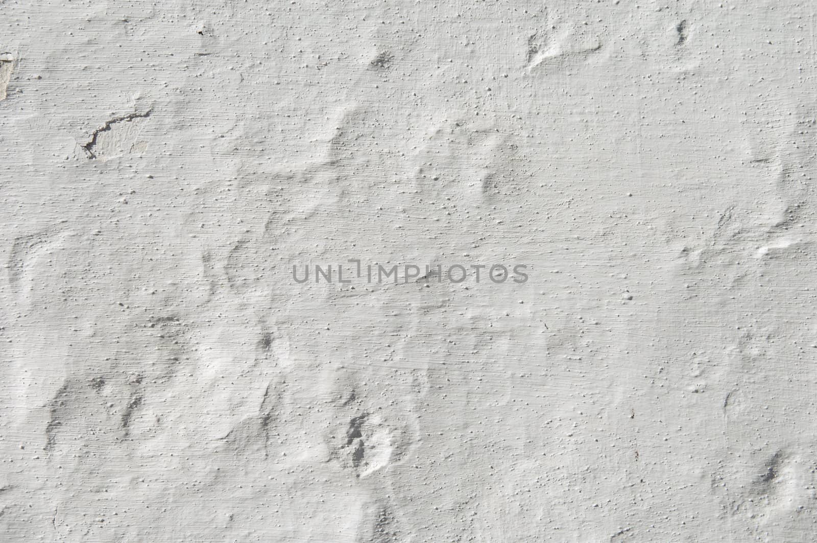 Detail of a rugged white wall suitable as background