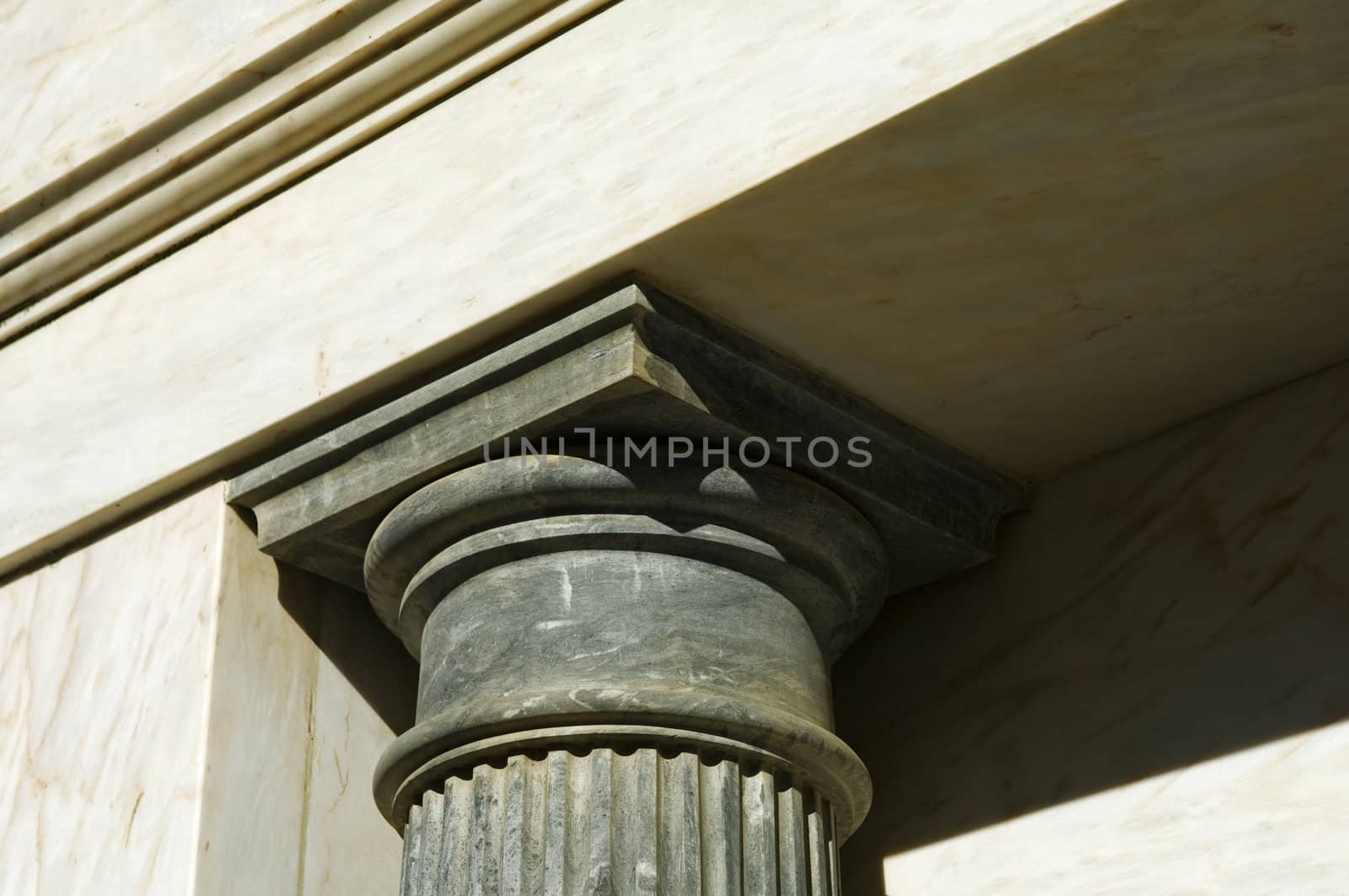 Building detail showing a black marble chapiter