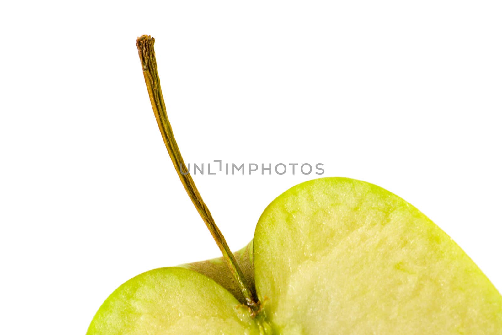 Green apple top with stalk cut in half on a white background