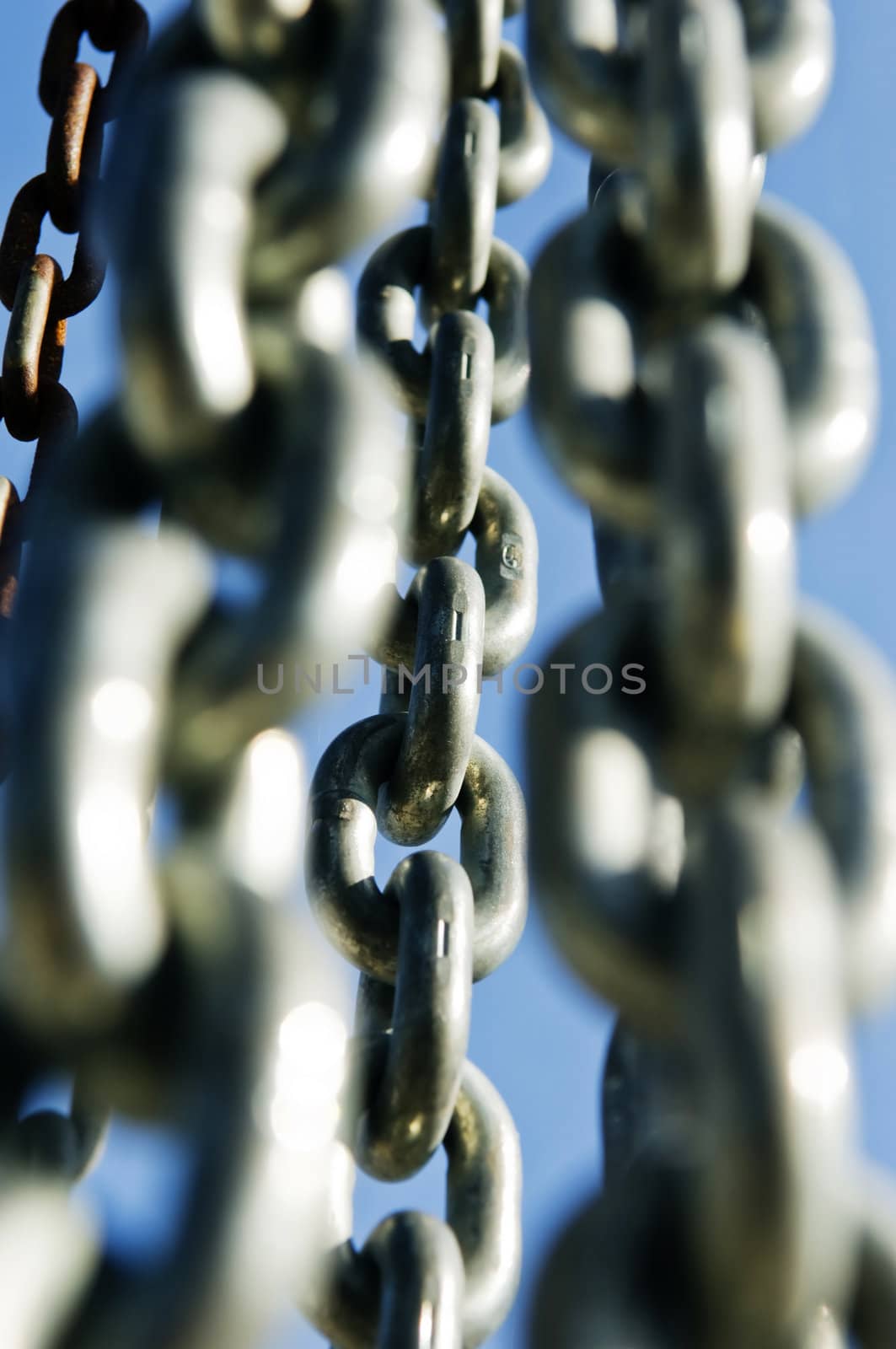 Group of chains against a blue sky