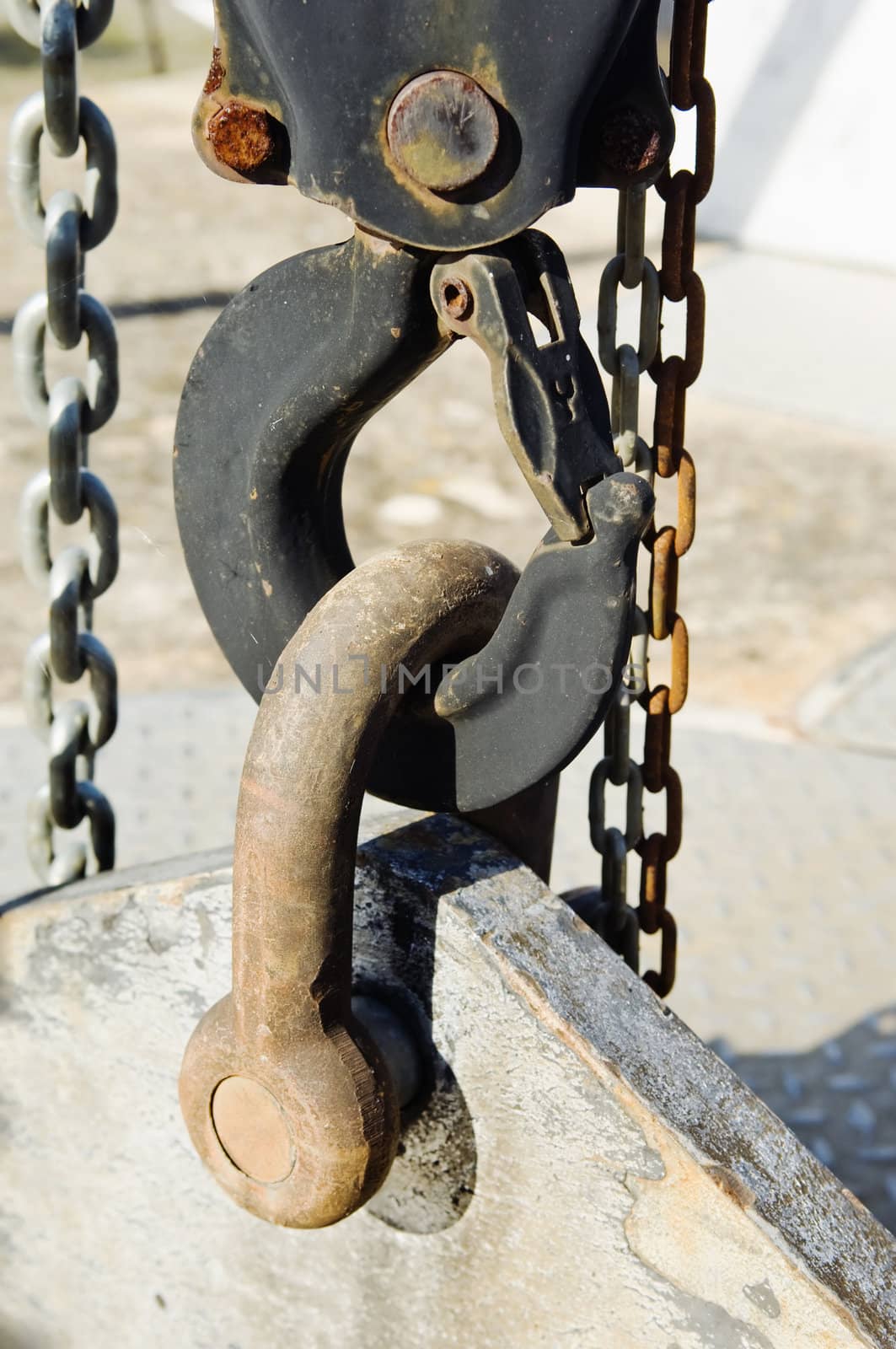 Industrial lifting hook with chains and beam