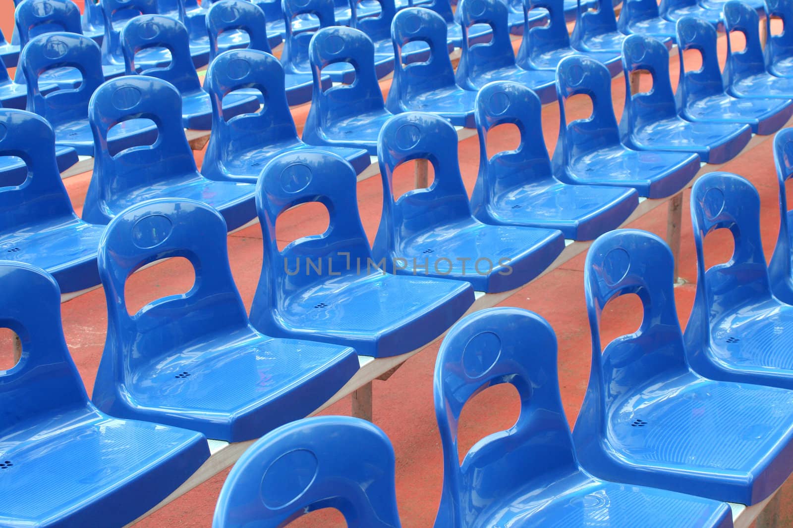 Rows of blue stadium seats