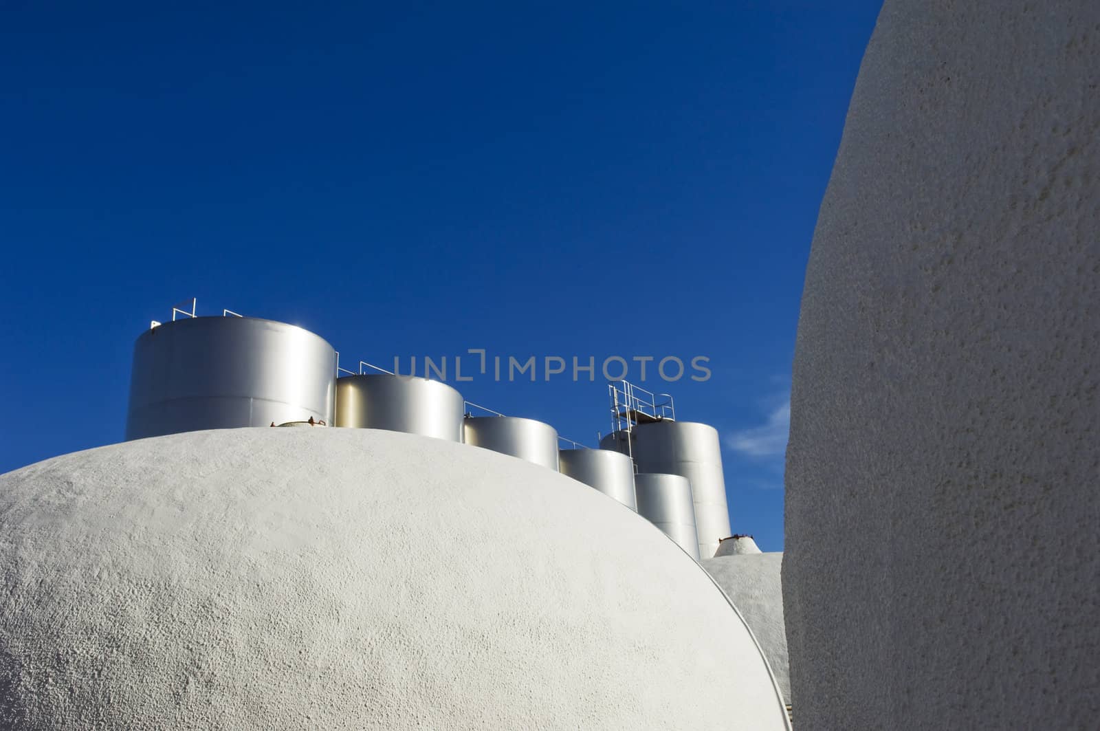 Stainless steel and concrete tanks in a wine cellar, Portugal