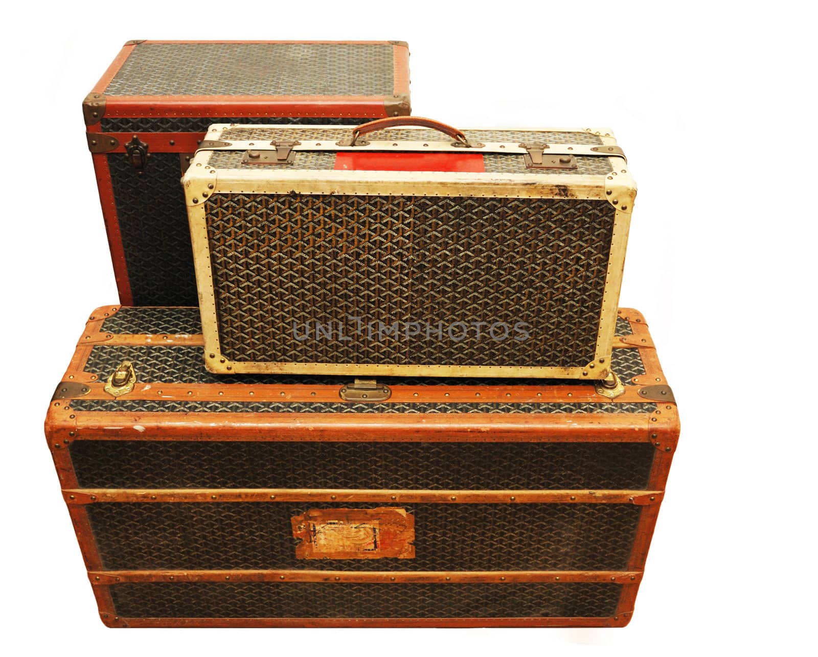 Three old suitcases isolated over white background.