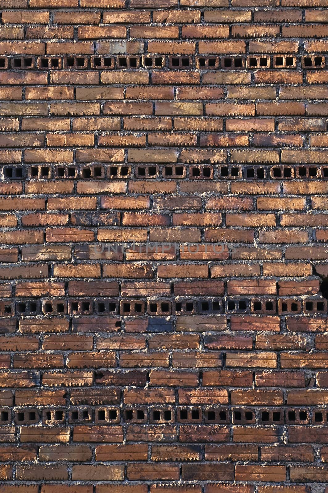 Rugged brick wall in an unfinished building

