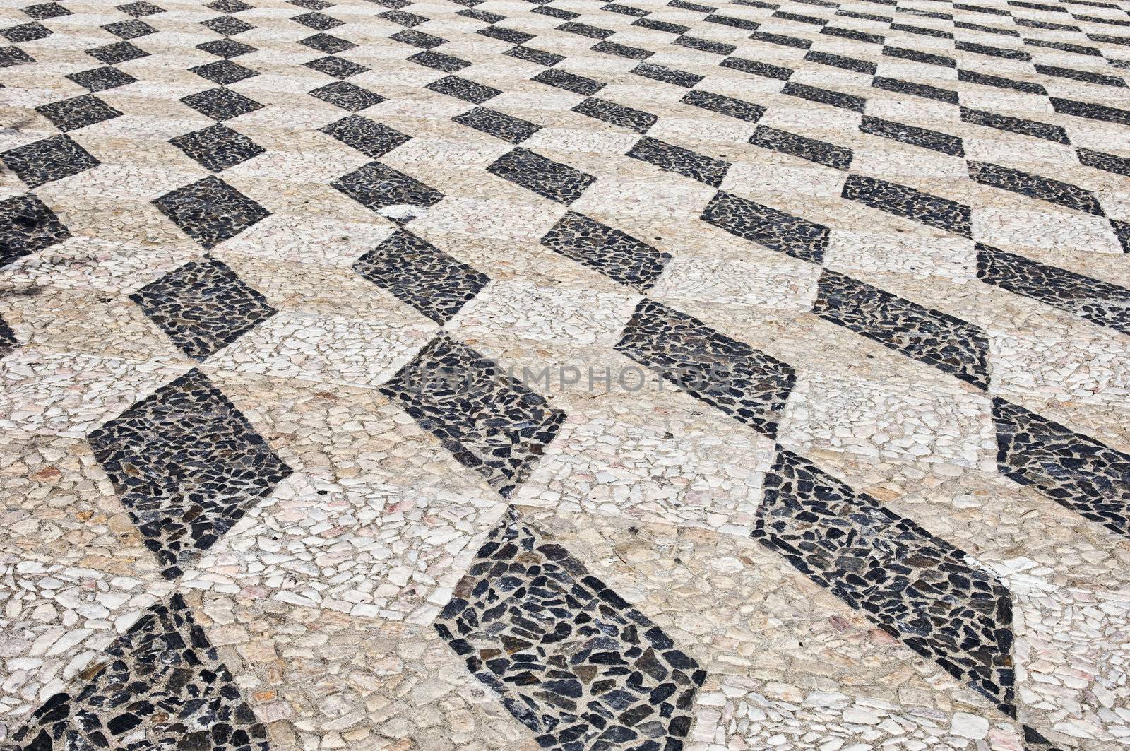 Nice geometric decorative stone pavement traditional from Portugal
