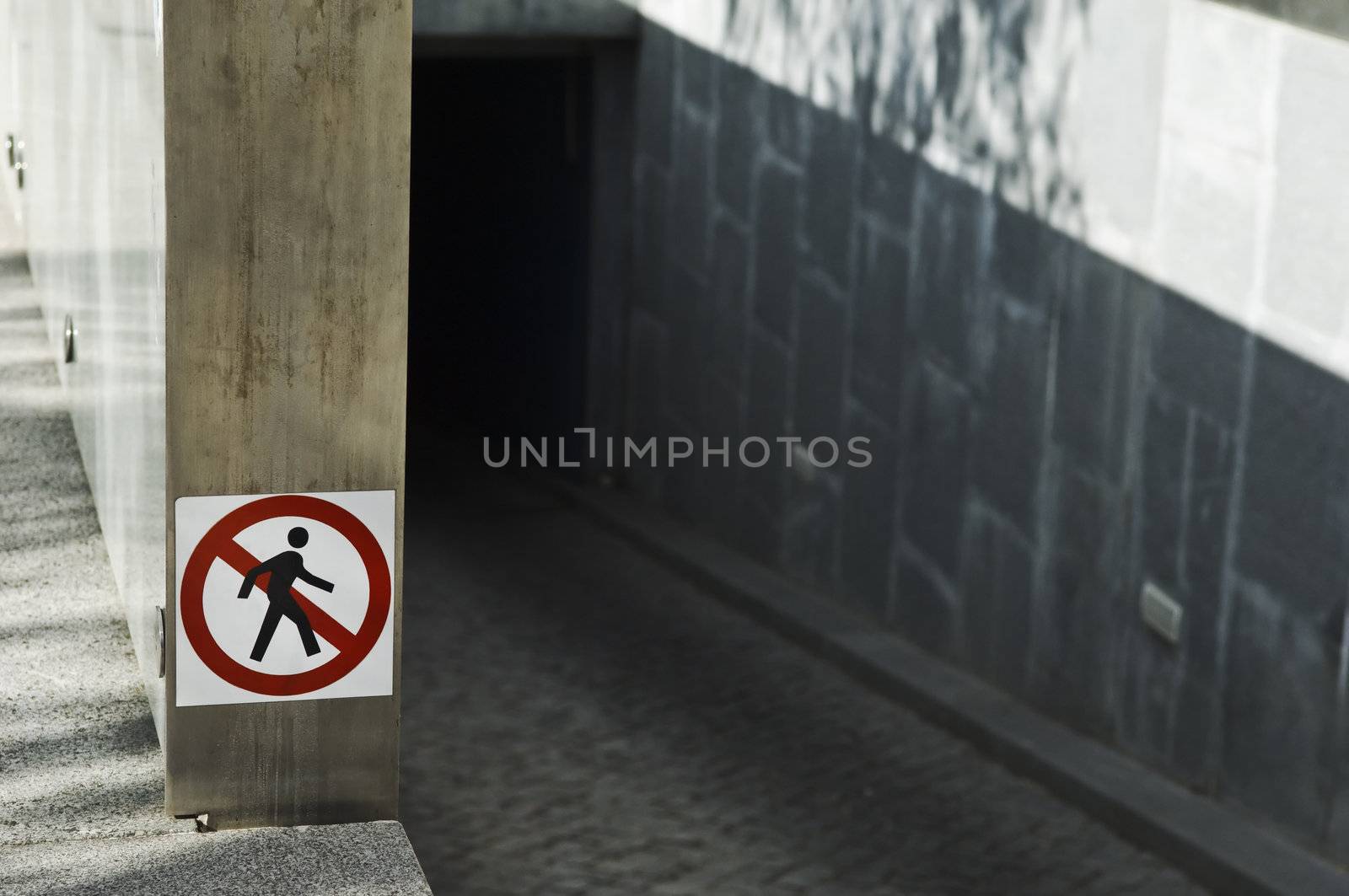 Forbidden to pedestrians, sign in the entrance of an underground car parking 
