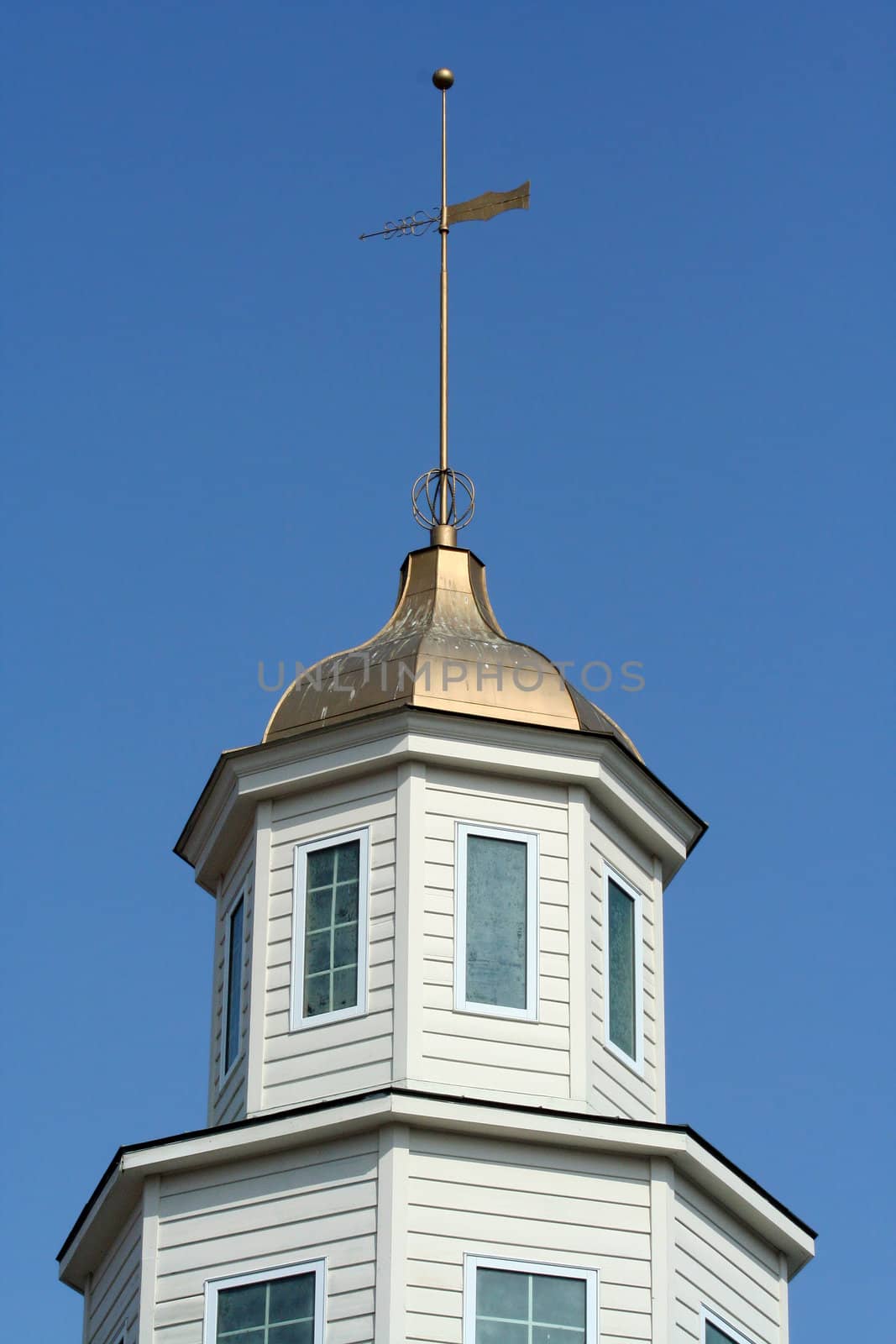 A Weather vane on a building peak