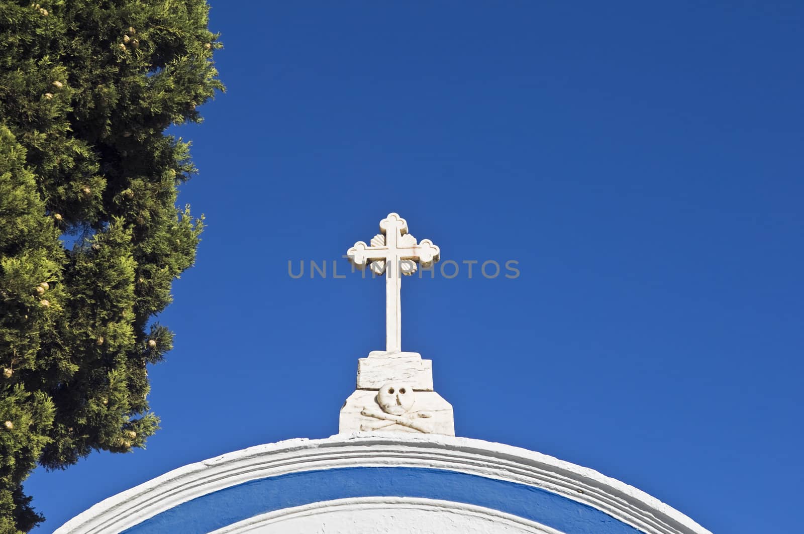 Marble cross over a cemetery entrance in Alentejo, Portugal