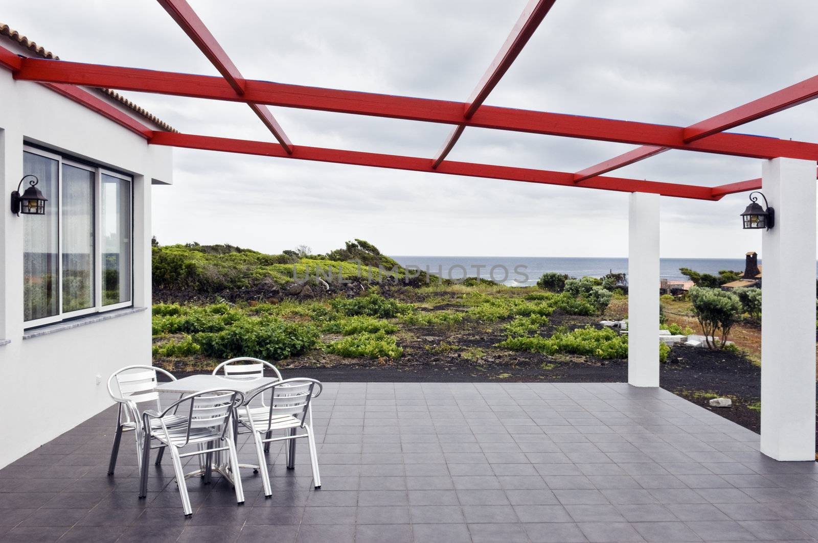 Chairs in the terrace of a seaside restaurant, Azores