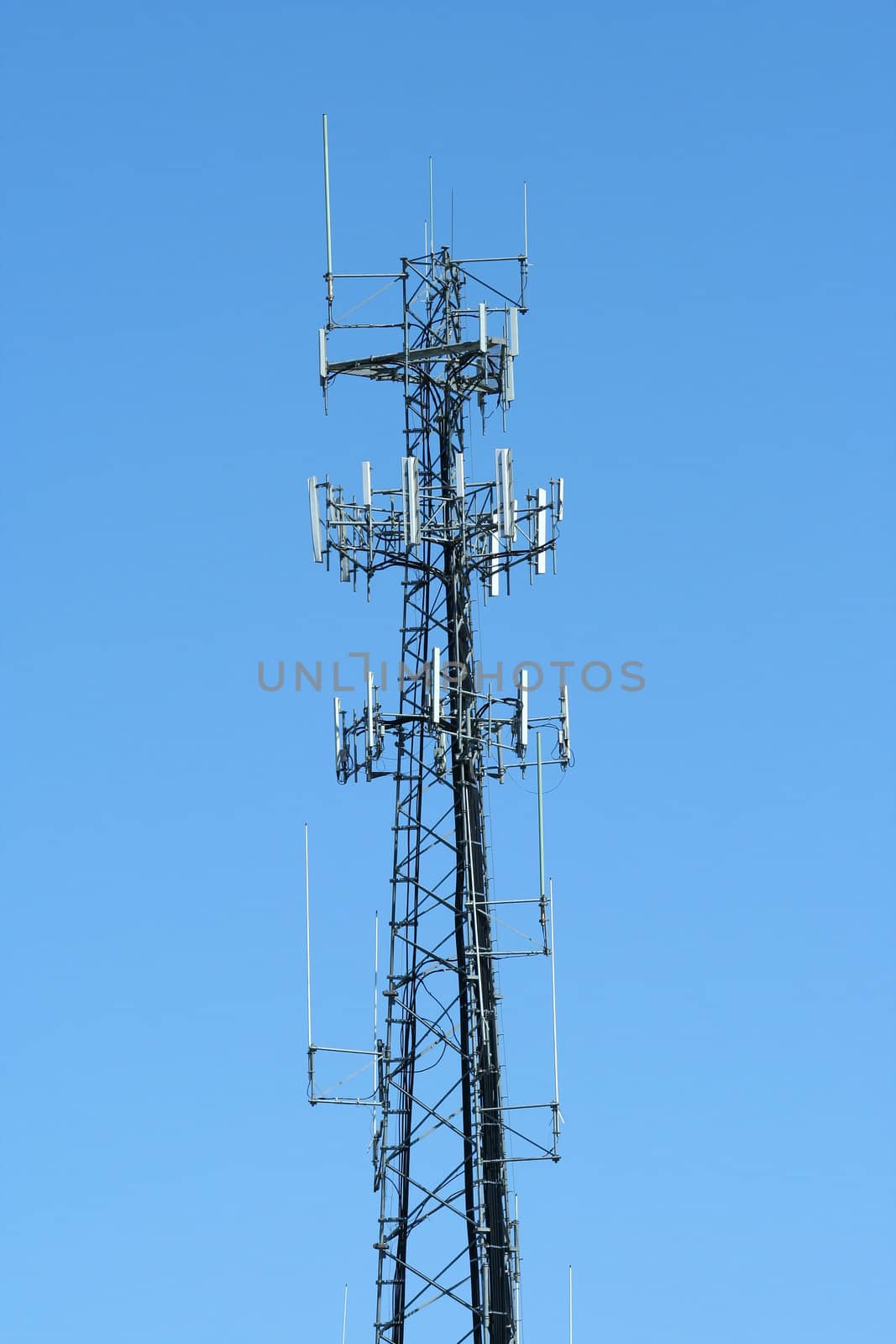 A Antenna radio tower against blue sky