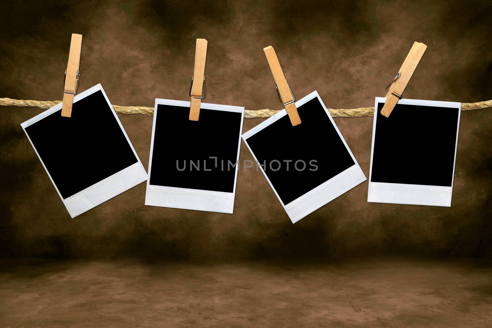 Empty Blank Film Frames Hanging From a Rope By Clothespins. Insert Your Own Images or Text