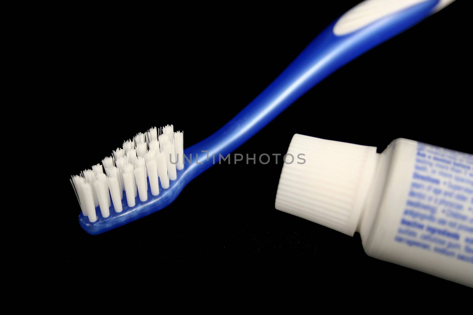 Blue toothbrush and toothpaste