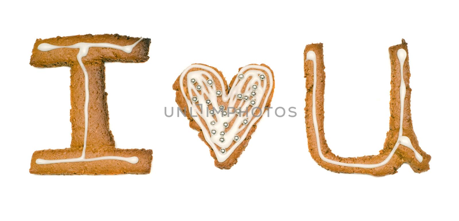 Closeup view of three cookies cut out into shapes that spell I love you, isolated against a white background