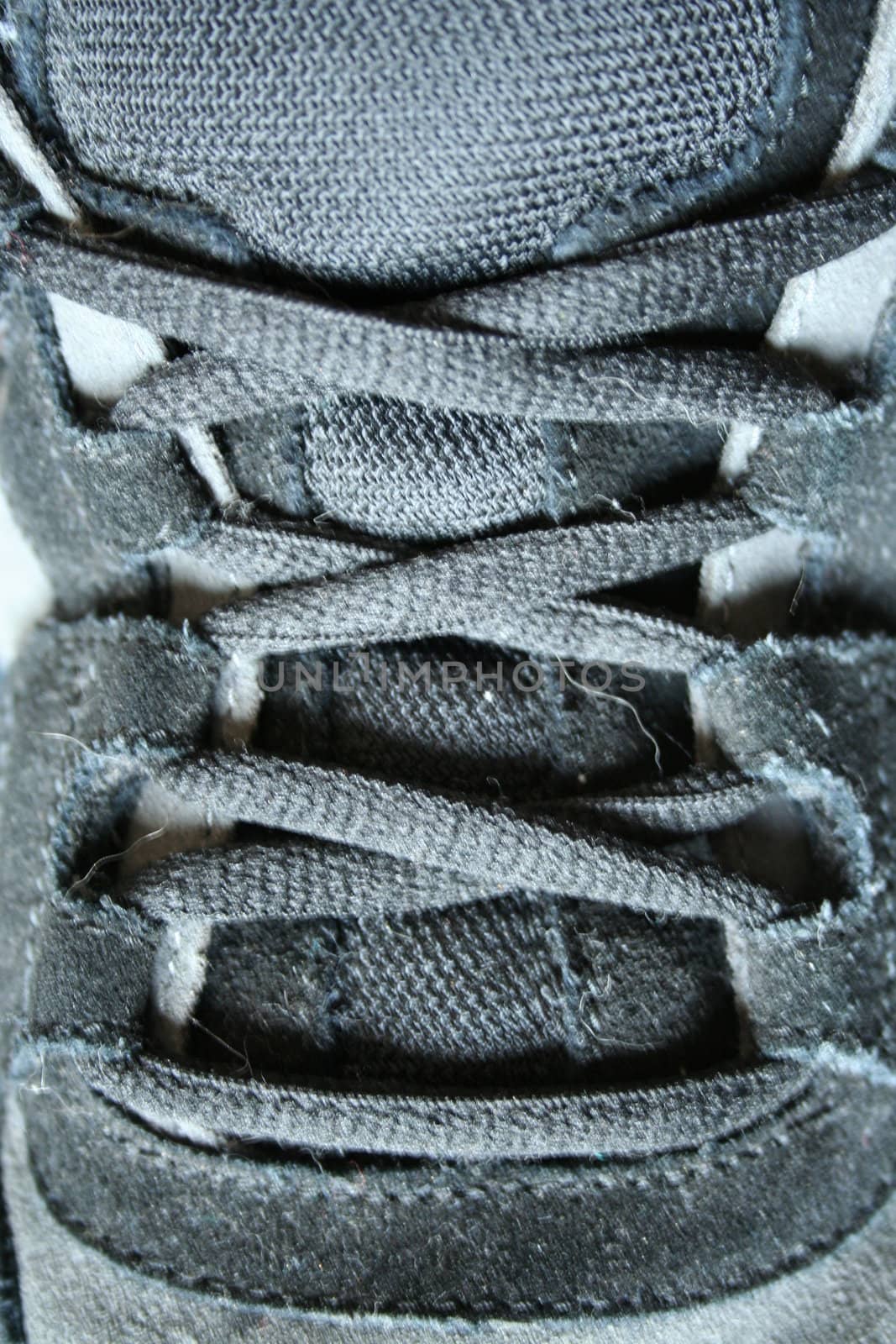 A close up of  Black sneaker shoe laces