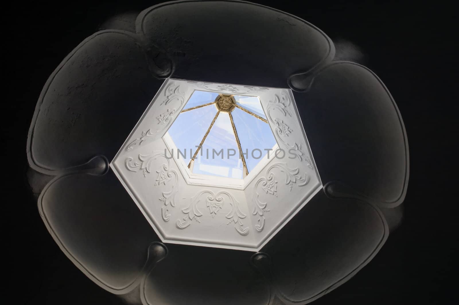 Vintage decorated skylight, flower shape, with plasterwork decoration
