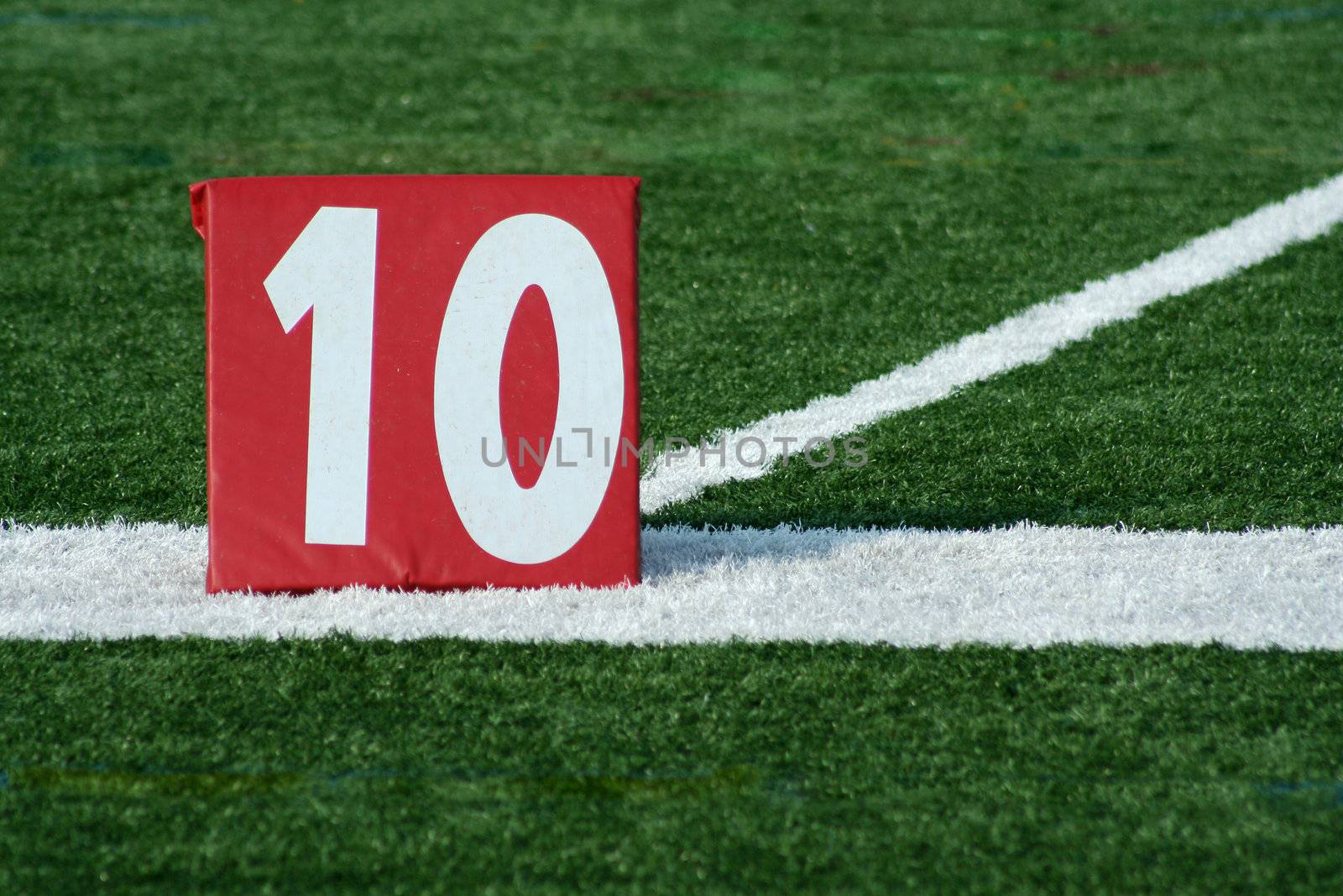 A red Football ten yard marker 