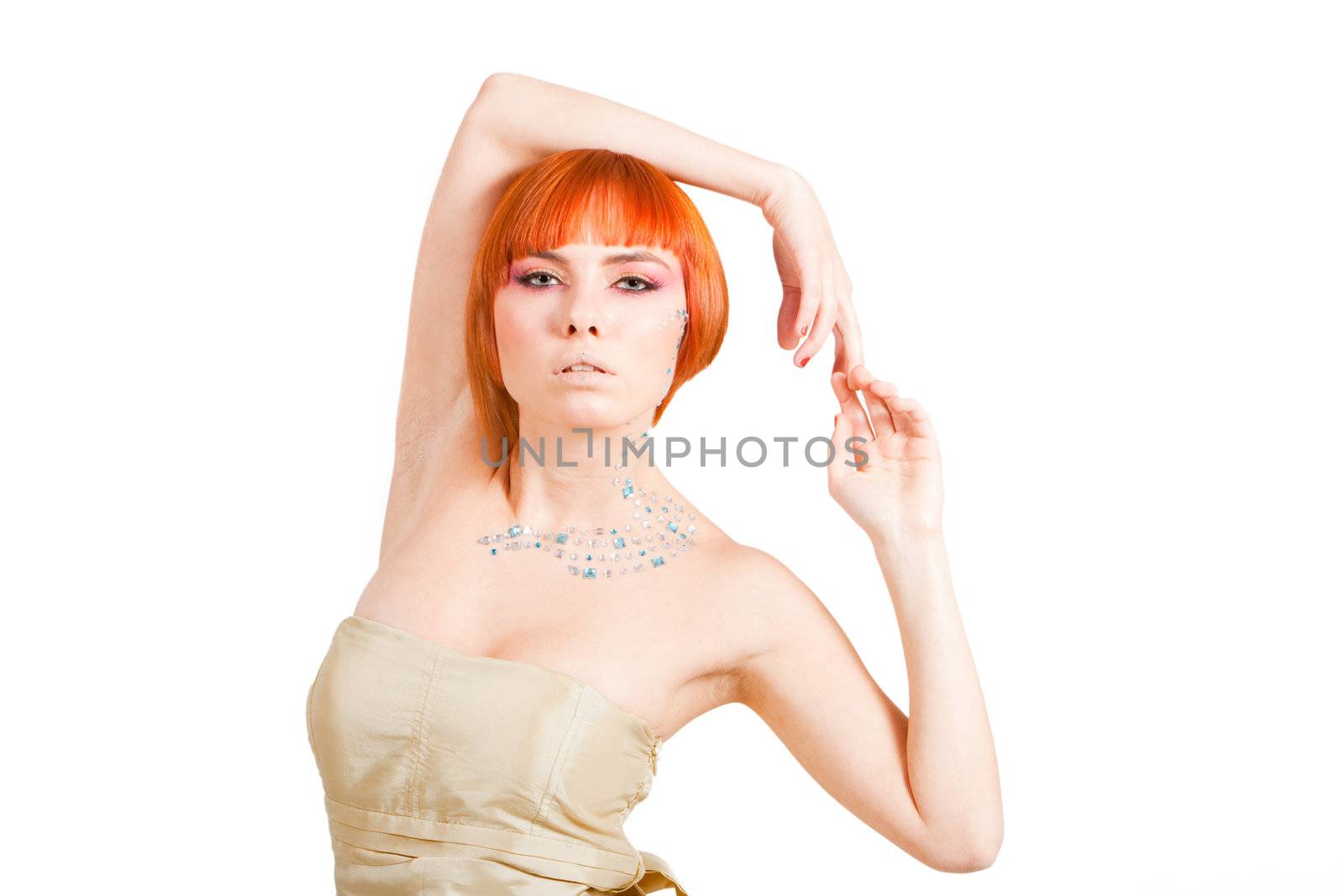 Beautiful redhead Caucasian girl with rhinestones and arms around her head, isolated