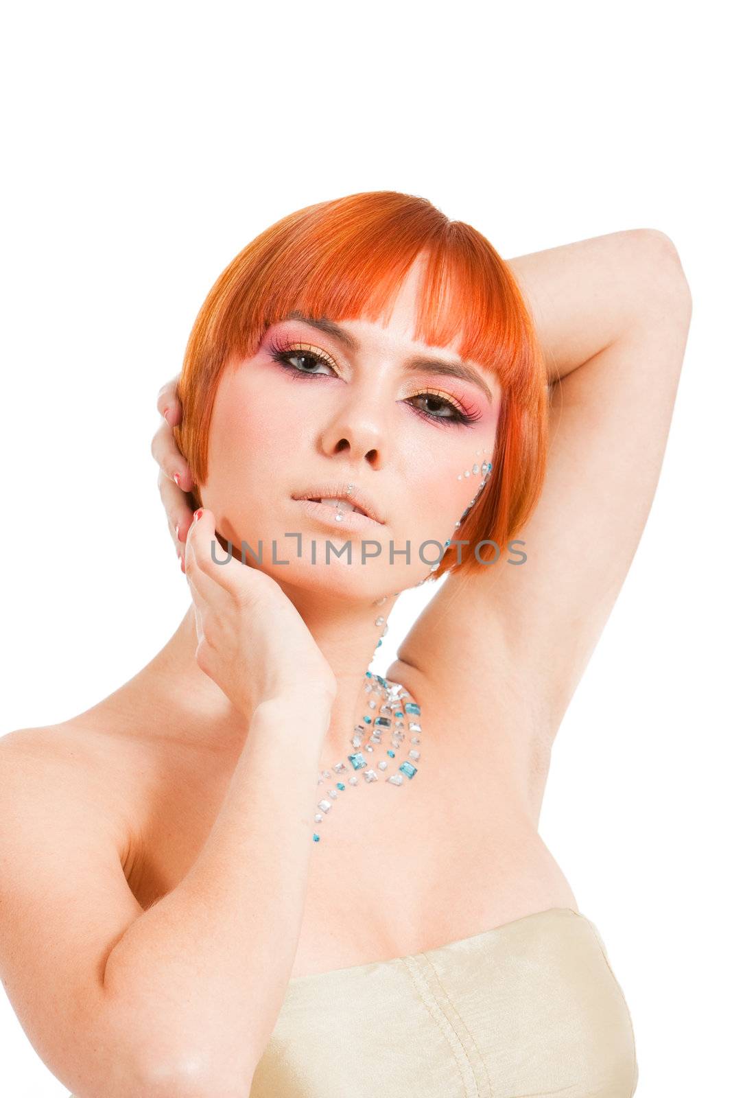 Beautiful redhead Caucasian girl with rhinestones and arms around her head, isolated