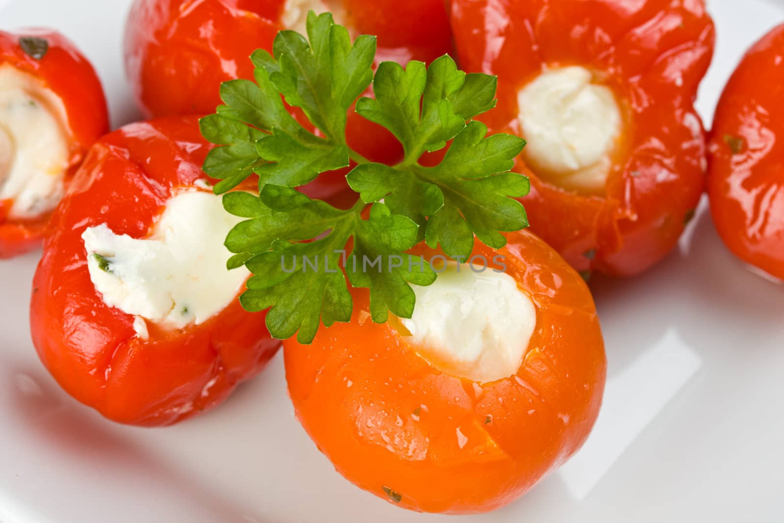 stuffed tomatoes on a white plate