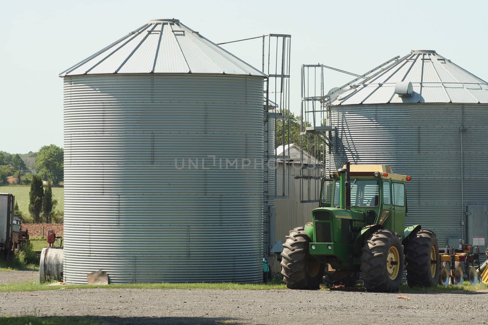 Green Farm Tractor and silos