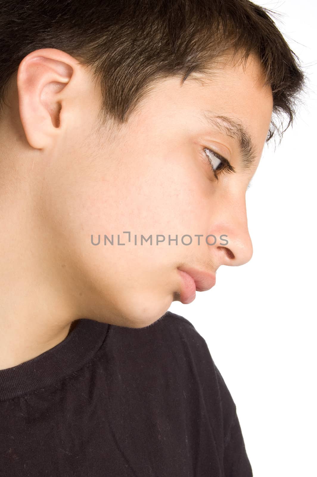 portrait of a sad looking pakistan teenage boy on white