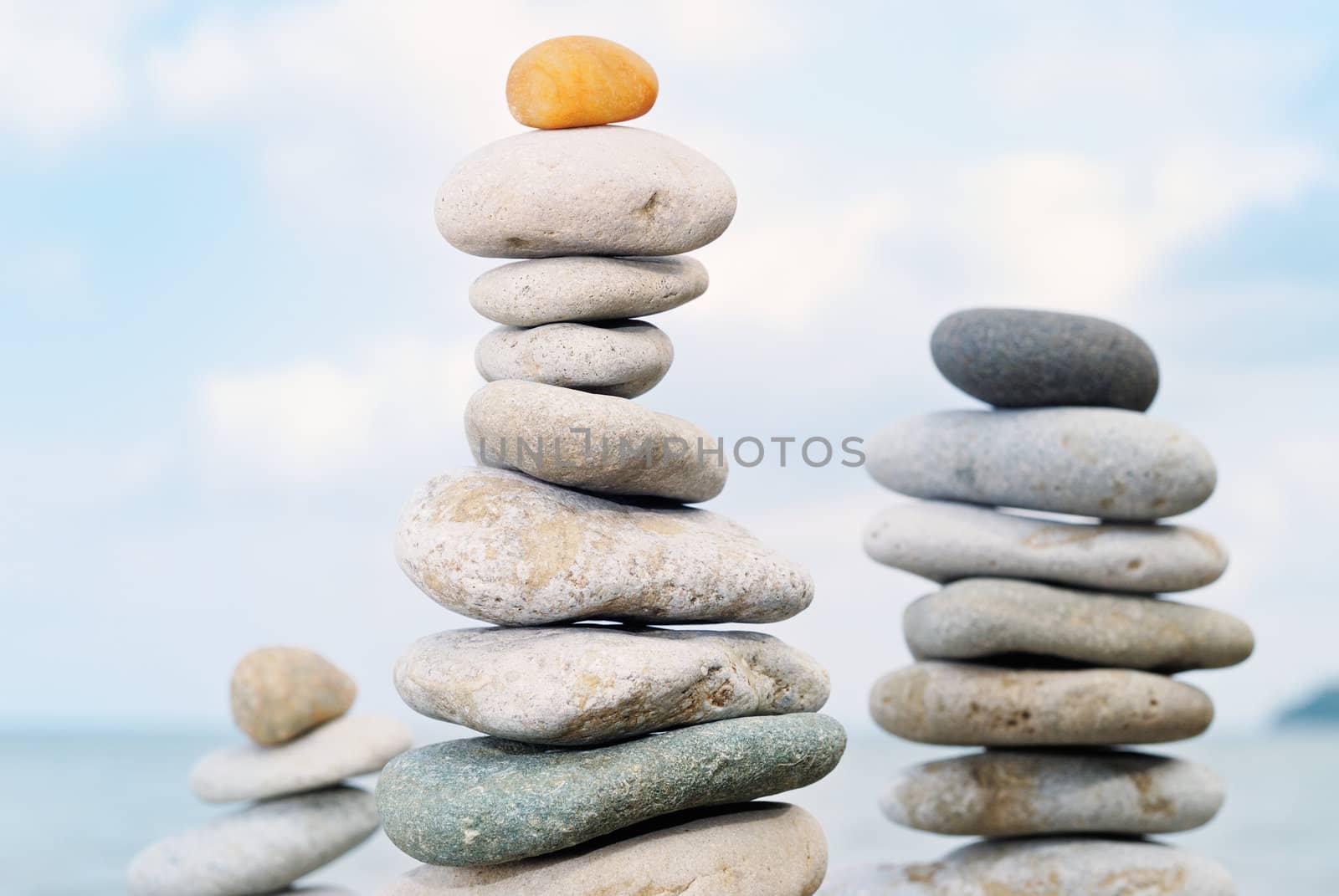 Three stone tower built of colored pebbles