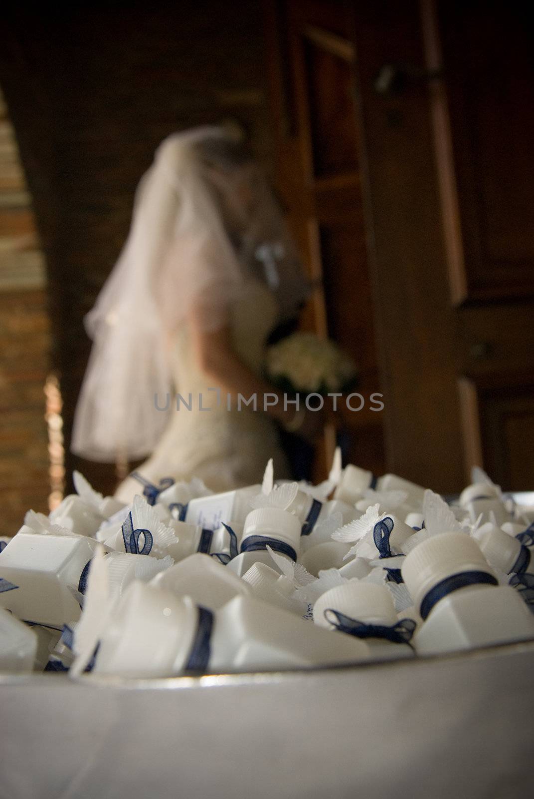 Confetti bubbles in a bowl with bride in the background outside church by Ansunette