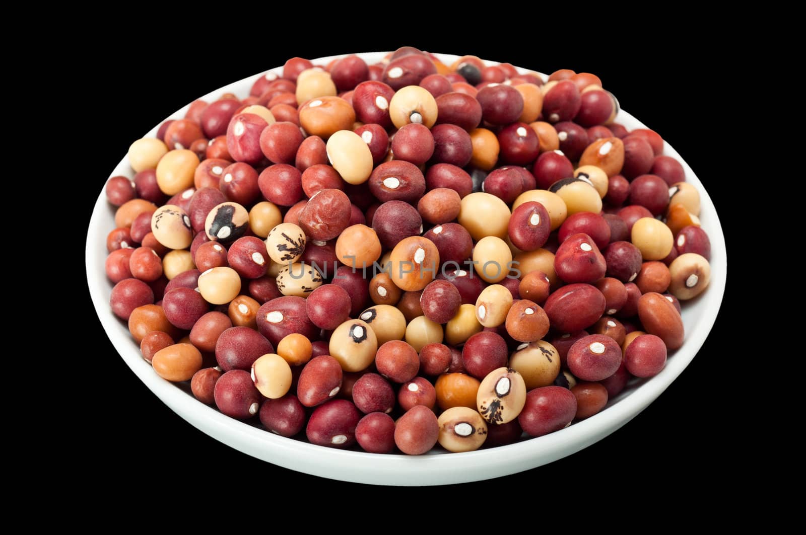 White bowl filled with jugo beans, isolated on a black background