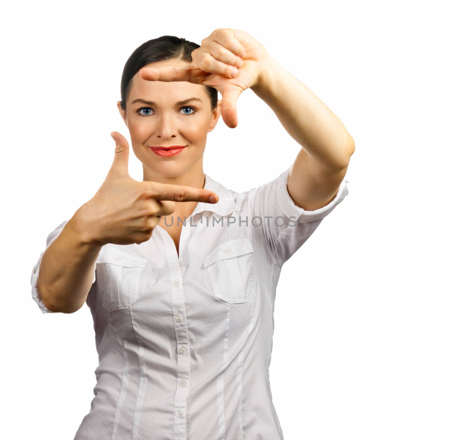 An isolated portrait of a beautiful business woman making a frame with her hands
