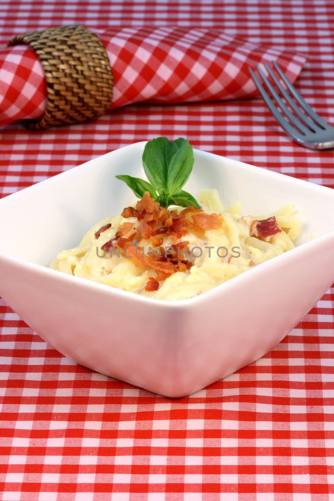 Gourmet exquisite carbonara pasta plate made with fancy organic bacon, eggs, heavy cream, and  parmesan cheese  