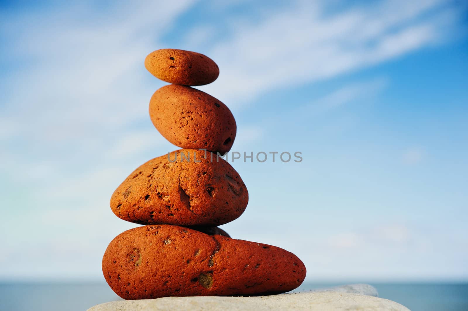 Several red-cobble-stones in tandem on the shore