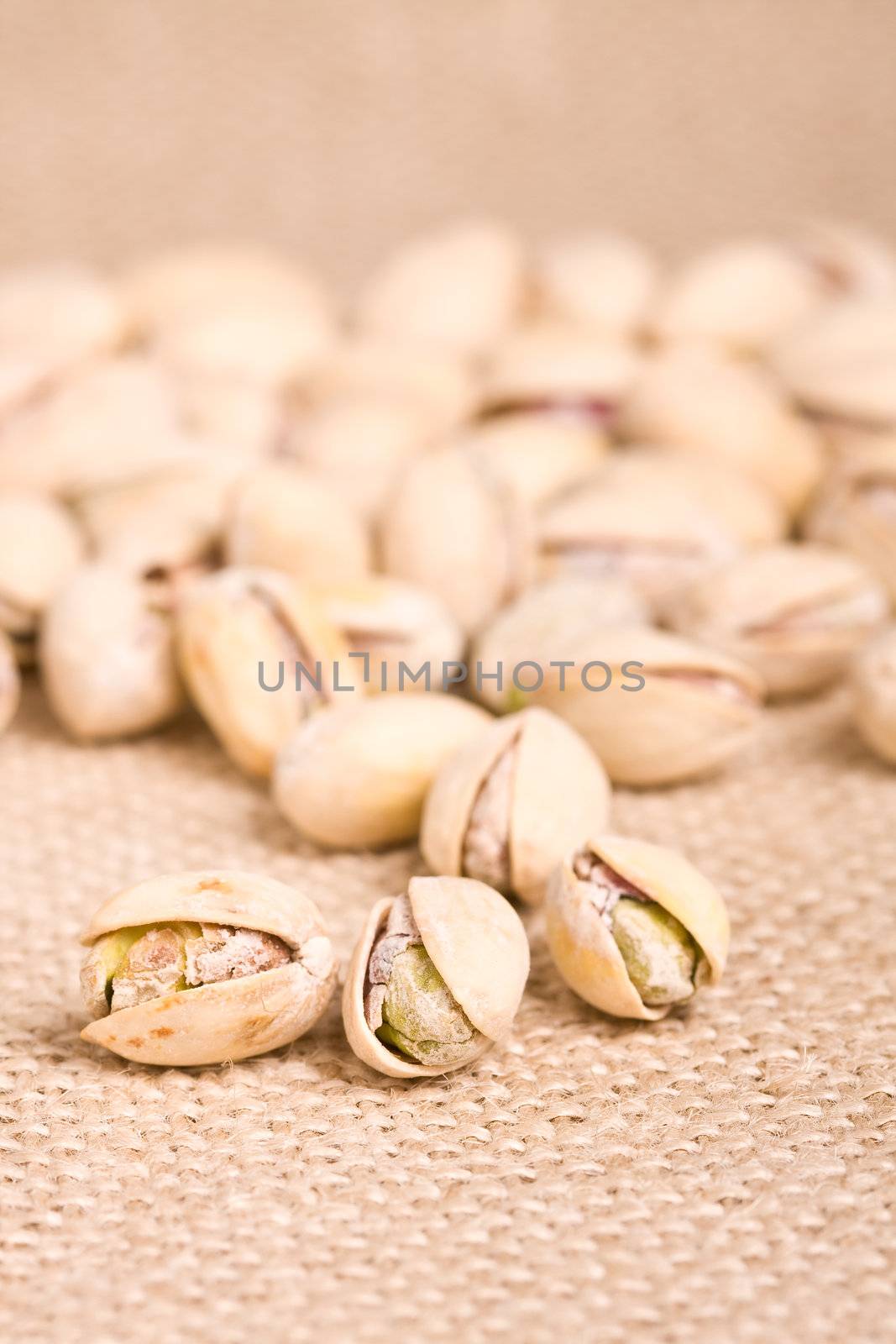 healthy nuts pistachios on a burlap canvas shallow depth of view