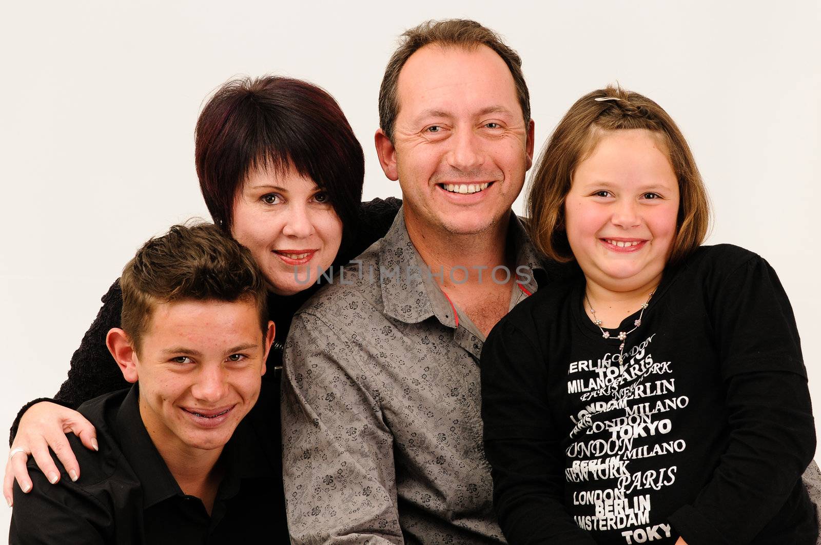 a young good looking family with sexy teenage children smiling
