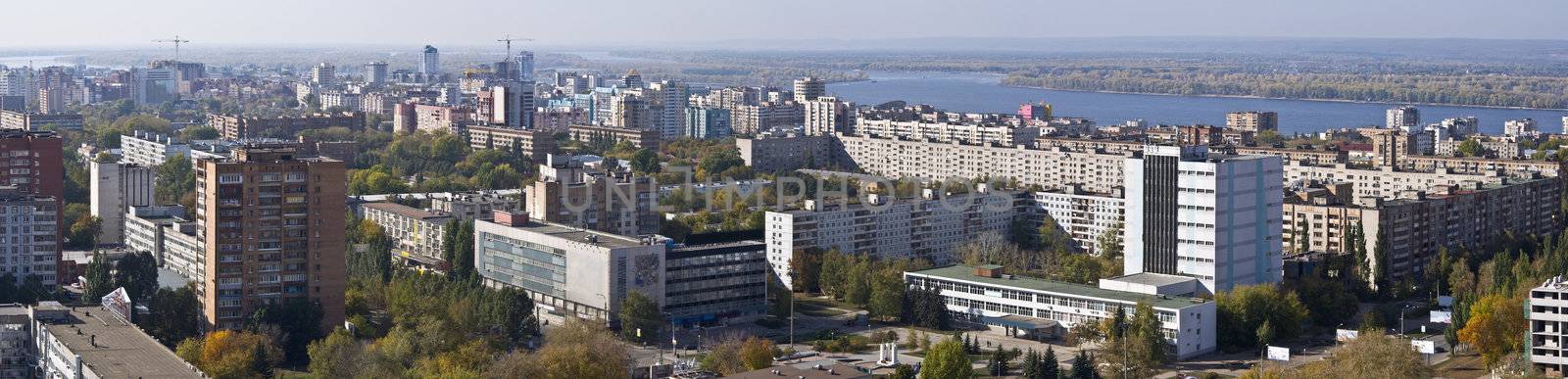 Urban landscape. XXL Size. Typical residential area on the riverbank. The view from the heights in the background the river Volga and Zhiguli Mountains. Russia.  