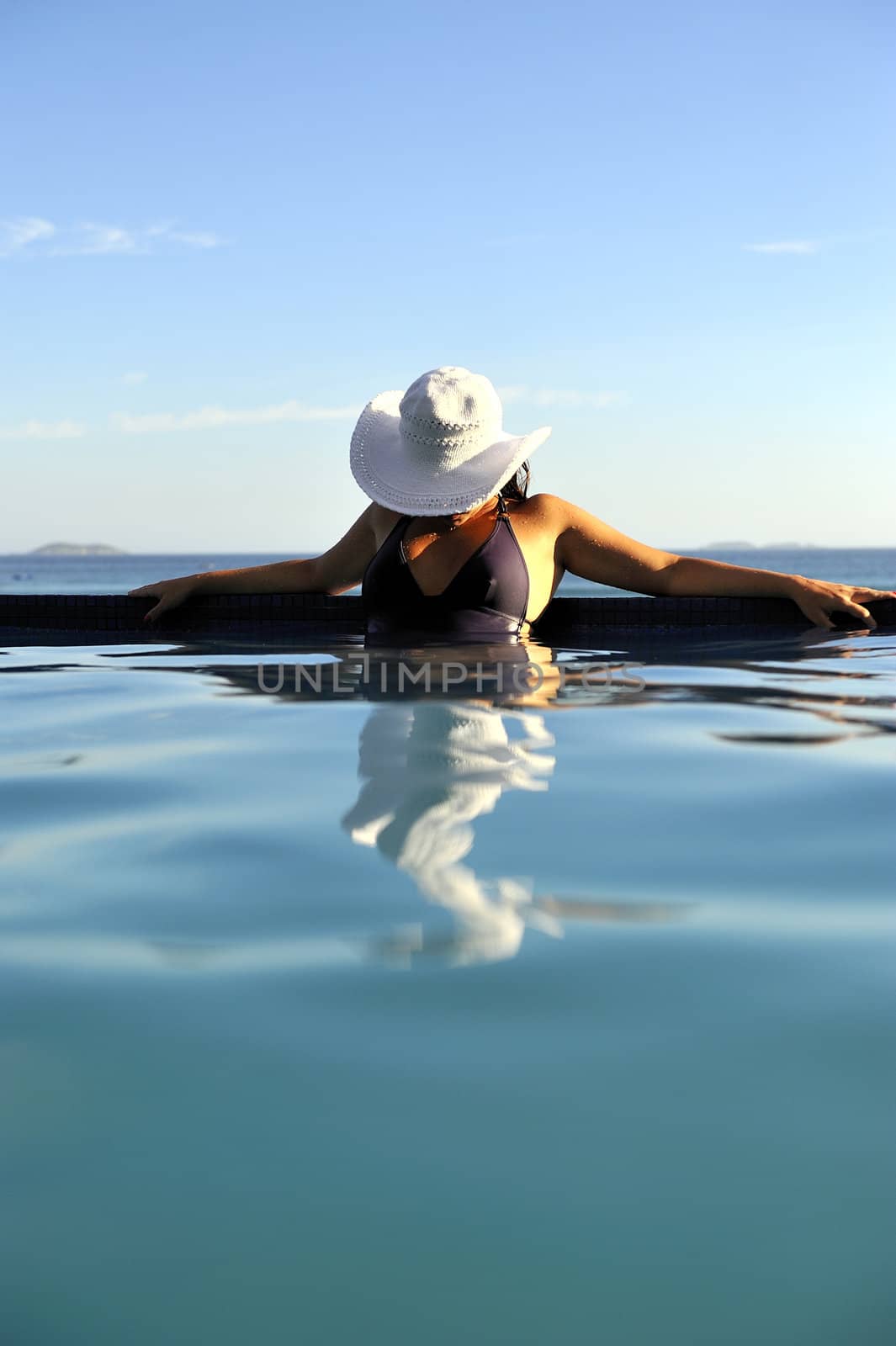 Pretty woman enjoying the swimming pool in Buzios, Brazil