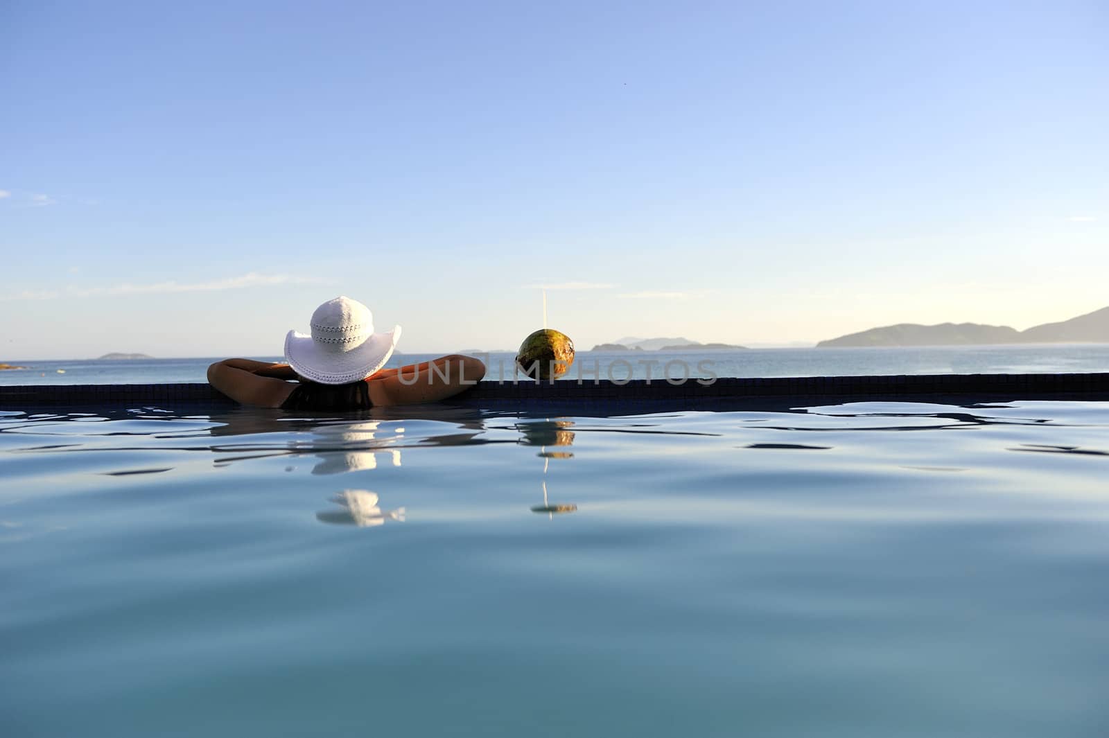 Pretty woman enjoying the swimming pool in Buzios, Brazil