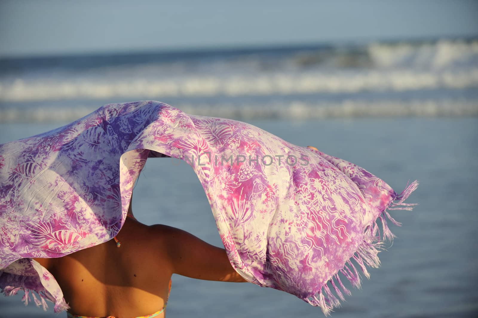 Woman enjoying the beach by swimnews