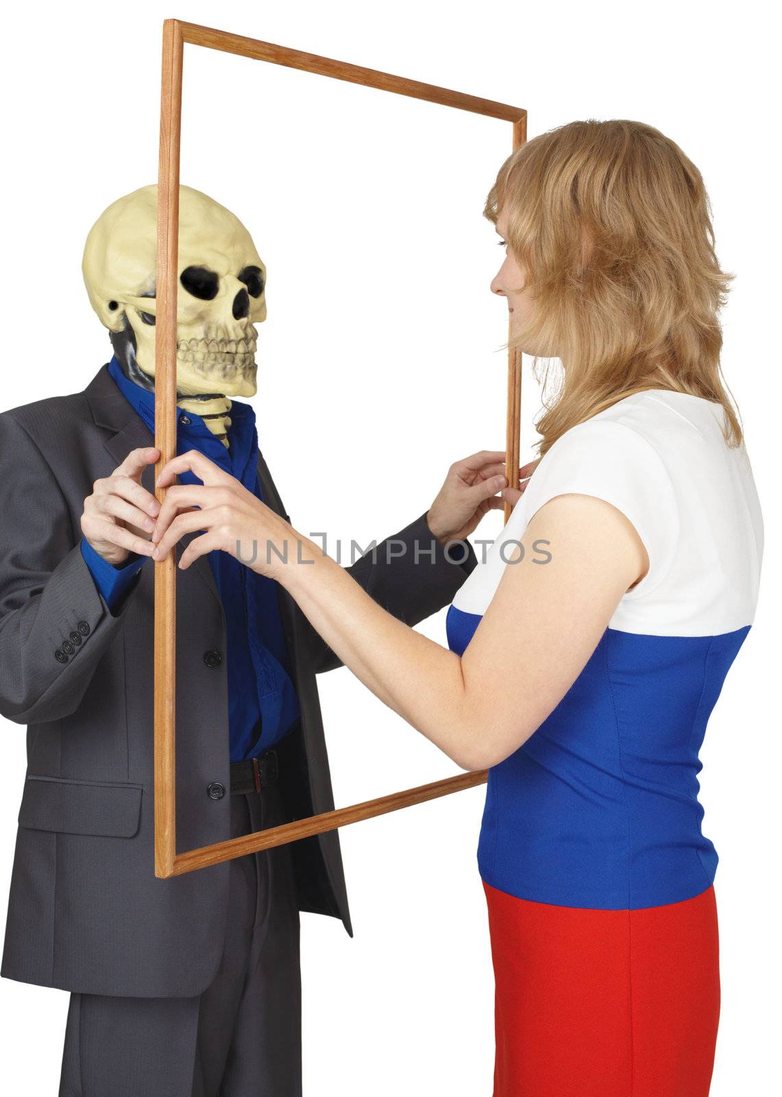 Woman looks at skeleton as reflected by pzaxe