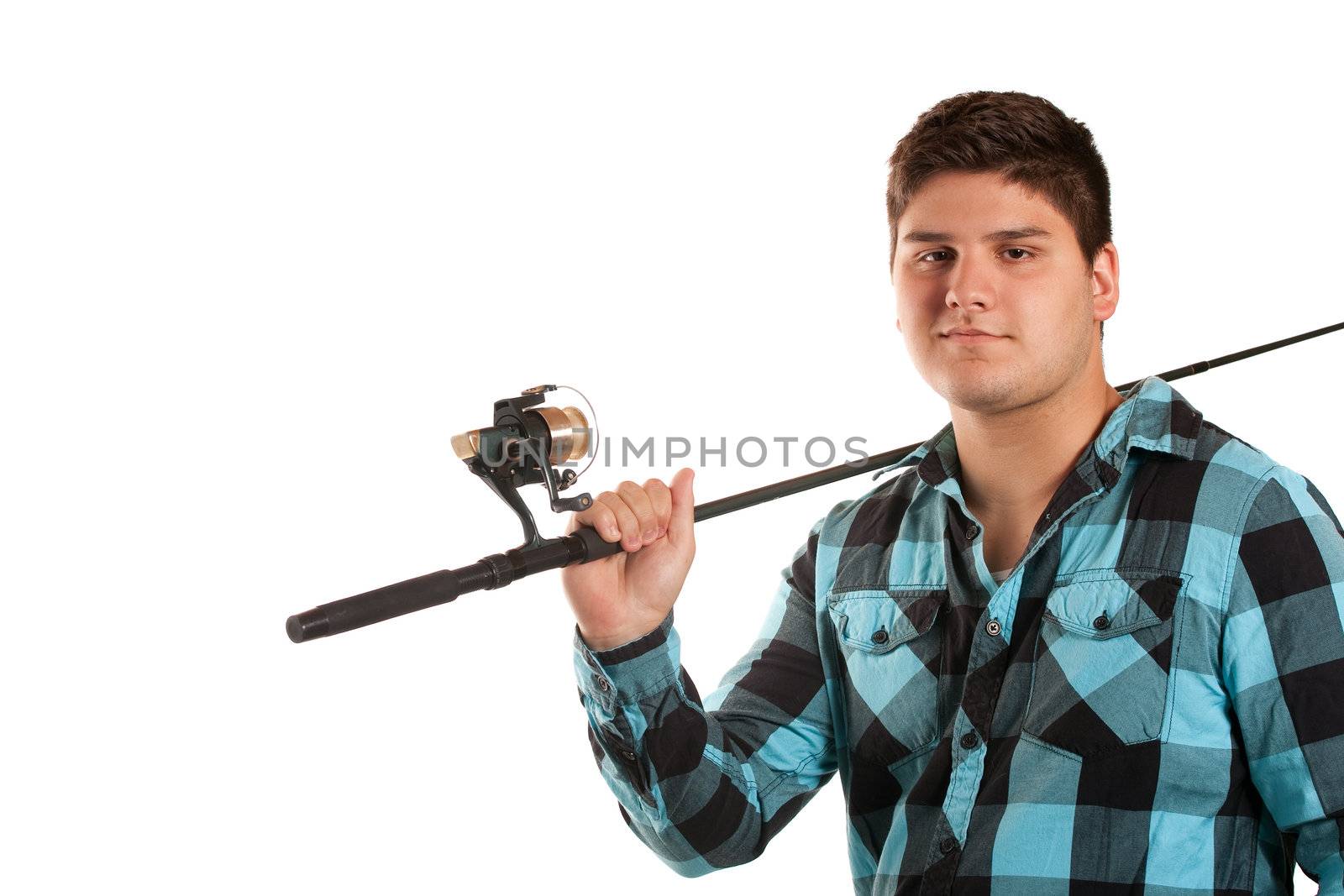 A young man poses with his fishing reel isolated over white in studio with negative space.