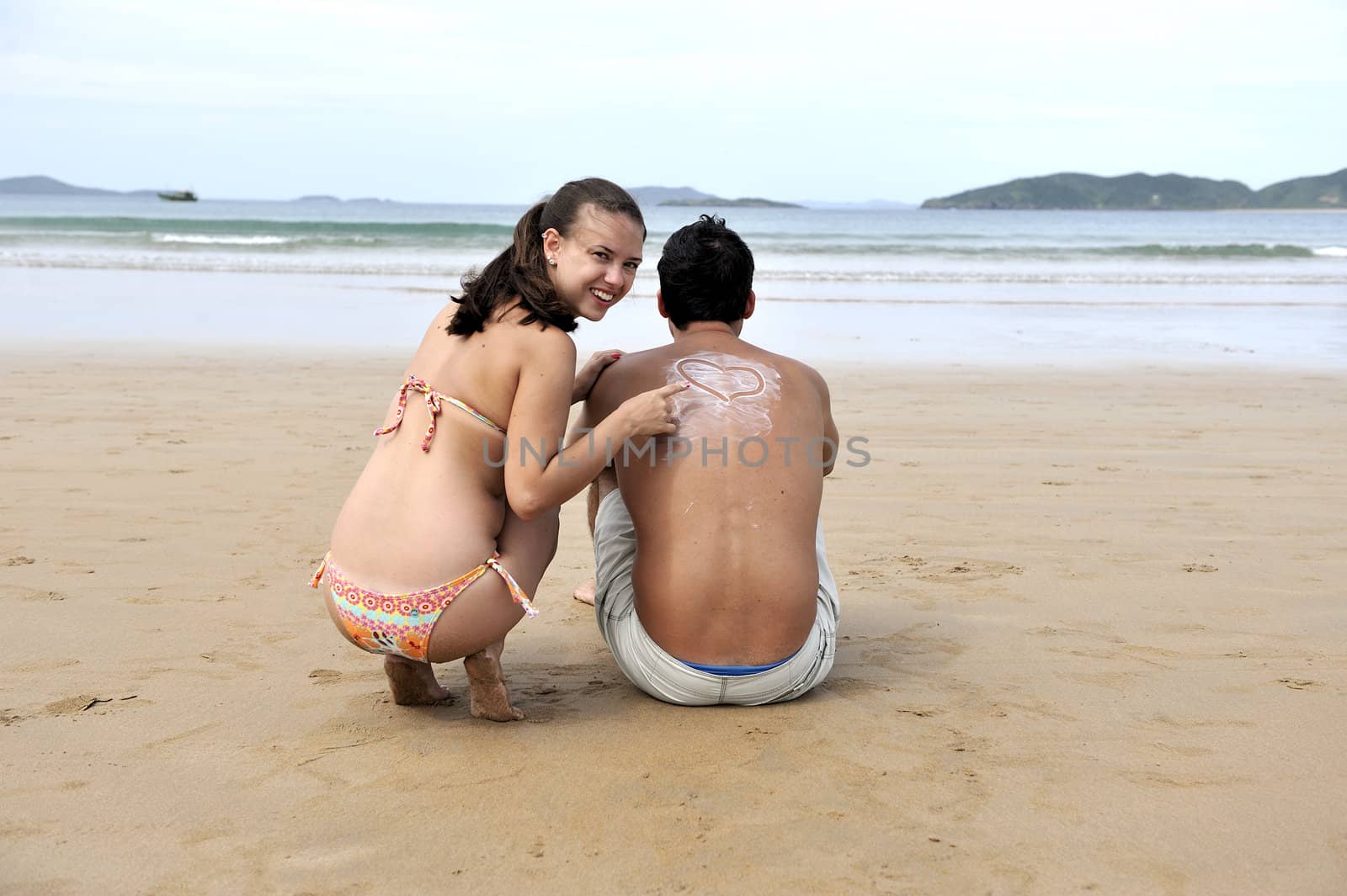Loving couple having fun on the beach
